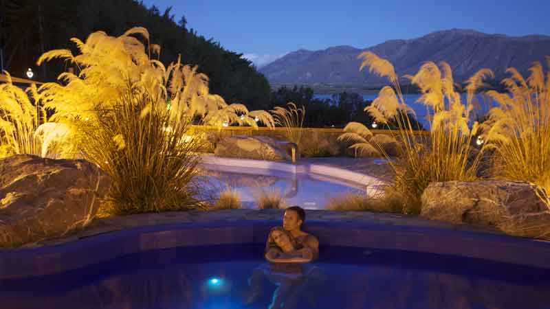 Relax in the stunning hot pools at Tekapo Springs, overlooking the Lake and Two Thumb Mountain range.